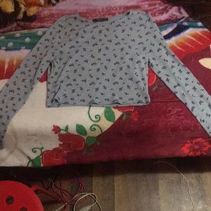 A gray long sleeve floral crop top